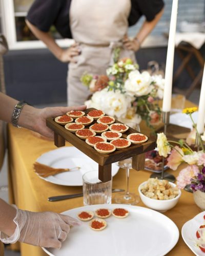 Wedding table for guests, decorated with candles, are served with cutlery and crockery