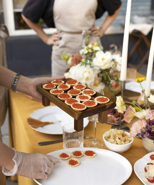 Wedding table for guests, decorated with candles, are served with cutlery and crockery